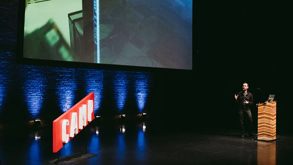 Denis speaking at a conference in Calgary