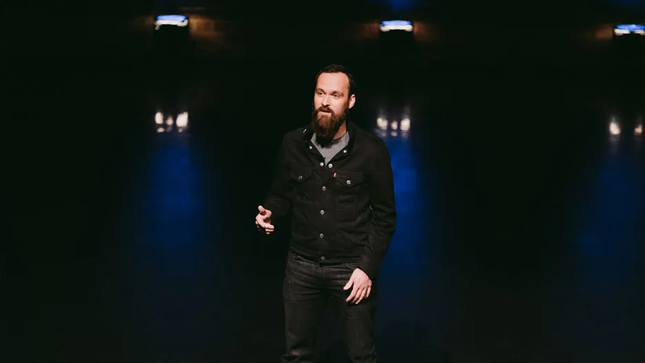 Denis speaking at a conference